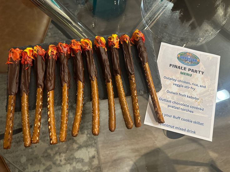 Pretzels, chocolate covered, Survivor Survivor Themed Food Ideas, Survivor Theme Food Party Ideas, Survivor Theme Party Food, Survivor Theme Snacks, Survivor Watch Party Ideas, Survivor Party Invitations, Survivor Theme Bachelorette, Survivor Themed Crafts, Survival Party Ideas