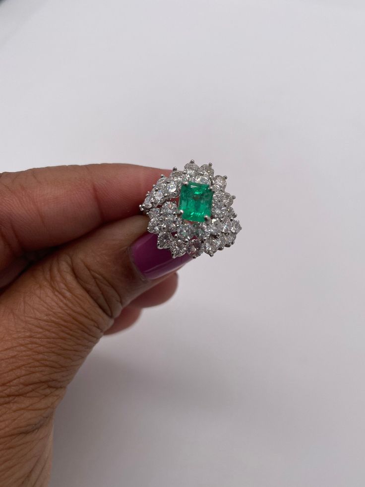 Stunningly gorgeous, Emerald & Diamond Ring set in Platinum. Handmade. Beautiful quality piece of jewelry. Approximately 2.20 ct. in Diamonds, Emerald is nice color & measures 1.15 ct. Diameter of ring is 19mm, size 6 but can be sized. Circa 1950's Luxury Gia Certified Diamond Gemstones, Elegant Green Diamond Gemstones, Luxury Gia Certified Emerald Gemstones, Luxury Emerald Gemstones With Prong Setting, Dazzling Green Diamond Ring, Fine Jewelry Diamond Cluster Gemstones, Elegant Brilliant Cut Emerald Gemstones, Gia Certified Elegant Emerald Gemstones, Elegant Gia Certified Emerald Gemstones