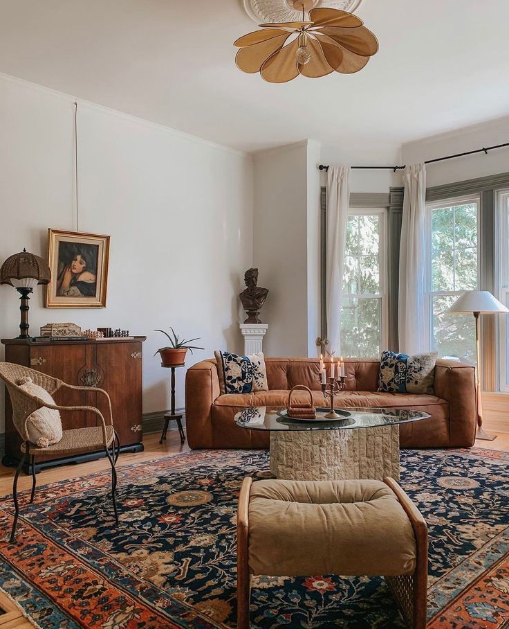 a living room filled with furniture and a large rug