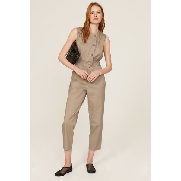 Brown cotton blend (97% Cotton, 3% Spandex). Jumpsuit. Sleeveless. Crewneck. Front zipper fly with button closure. 56" from shoulder to hemline. 26.5" inseam. 13" rise. 14" leg opening. Imported. Sleeveless Cotton Jumpsuits For Work, Sleeveless Cotton Jumpsuits And Rompers For Work, Sleeveless Summer Pantsuit For Office, Summer Sleeveless Pantsuit For Office, Summer Sleeveless Office Pantsuit, Fitted Sleeveless Cotton Jumpsuits And Rompers, Fitted Sleeveless Cotton Jumpsuit, Sleeveless Summer Office Pantsuit, Sleeveless Spring Pantsuit With Pockets