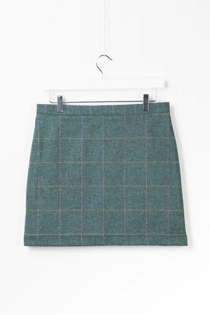 Embrace classic elegance with the Helmsley Tweed Skirt in dark green tweed. This sophisticated skirt features a timeless tweed pattern, providing a refined and polished look perfect for both casual and formal occasions. The high-quality fabric ensures durability and comfort, while the flattering cut enhances your silhouette. Pair it with a blouse or sweater for a chic, stylish ensemble that stands out with its traditional yet modern appeal. Crochet Wreath, Halloween Costume Mask, Halloween Arts And Crafts, Tweed Pattern, Green Tweed, Greeting Card Craft, Playset Outdoor, Gift Tag Cards, Wool Shop