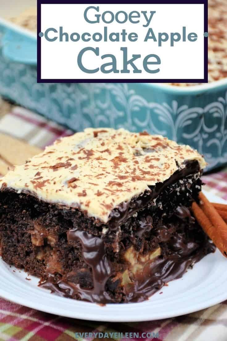 gooey chocolate apple cake on a plate with cinnamon sticks