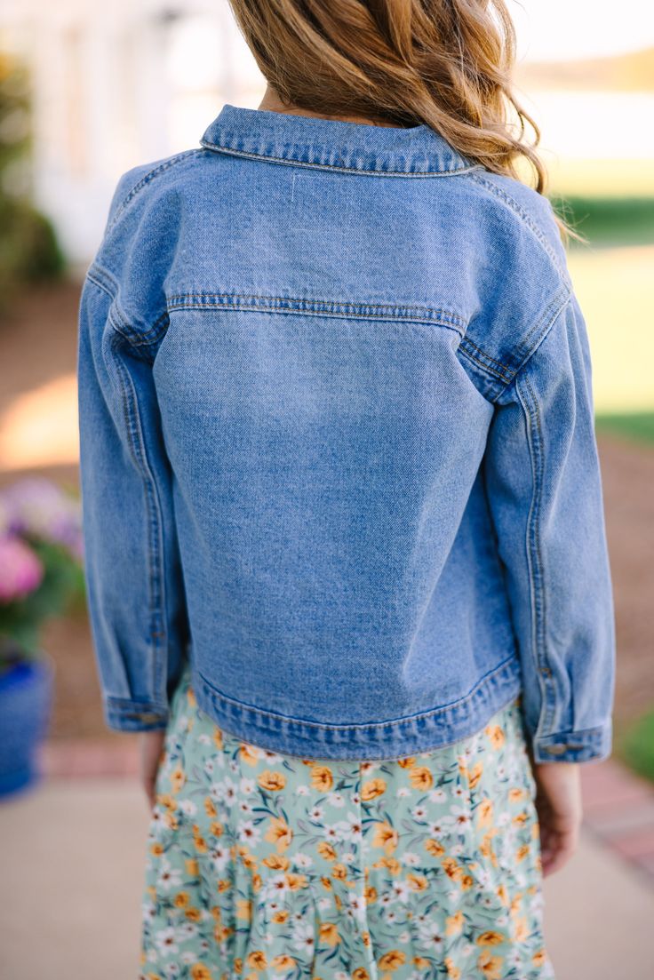 Who doesn't love a good jean jacket?! They look on everyone including girls! This jean jacket is going to layer so easily over all of your daughter's spring dresses and tops. Collared neckline Button down front closure Pockets No stretch Morgan is wearing the small. Dark Wash Button-up Denim Vest For Spring, Dark Wash Denim Vest With Button Closure For Spring, Trendy Medium Wash Denim Top For Spring, Spring Day Out Denim Vest In Medium Wash, Spring Day Out Medium Wash Denim Vest, Light Wash Denim Top For Spring, Spring Denim Top For Day Out, Spring Light Wash Denim Top, Dark Wash Cotton Denim Jacket For Spring