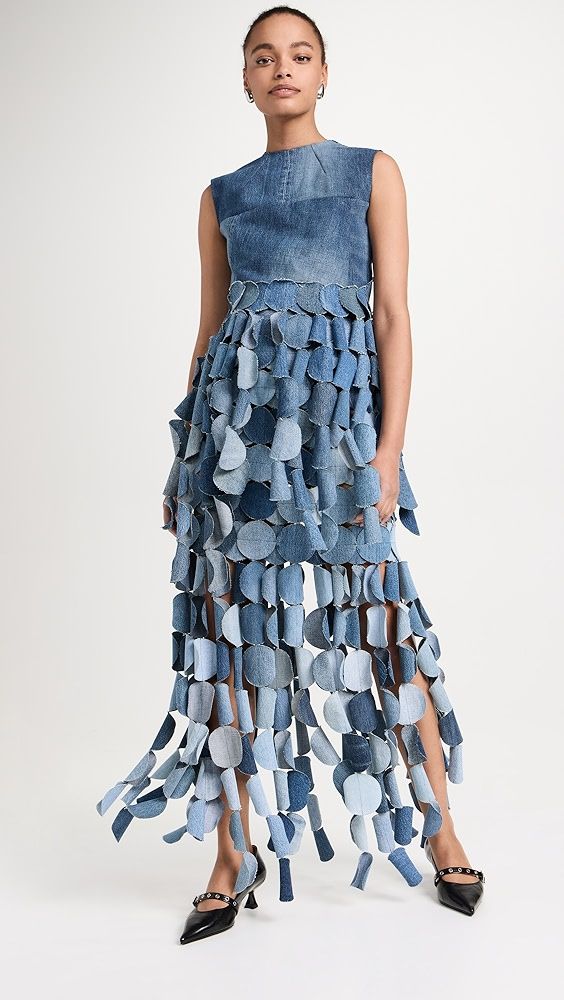 a woman in a dress made out of jeans