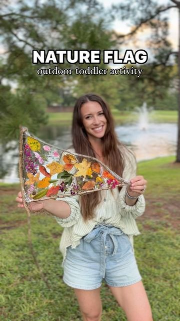 a woman holding up a colorful umbrella in front of her face with the caption nature flag outdoors reddiet activity