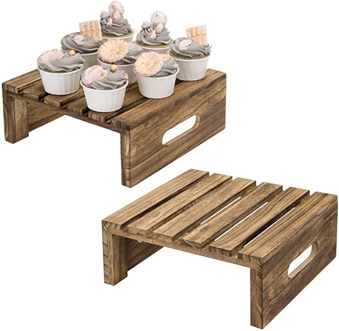 two wooden tables with cupcakes on them