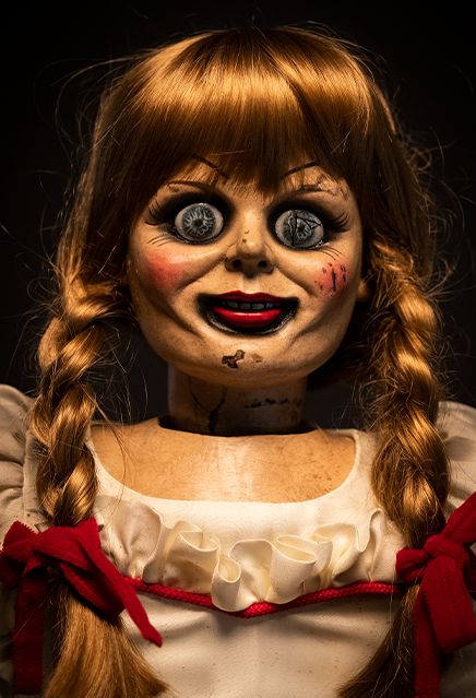 a creepy doll with long hair and big eyes