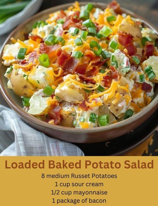 loaded baked potato salad with bacon, green onions and cheese in a bowl on a table