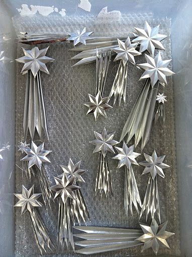 there are many silver stars on the tray