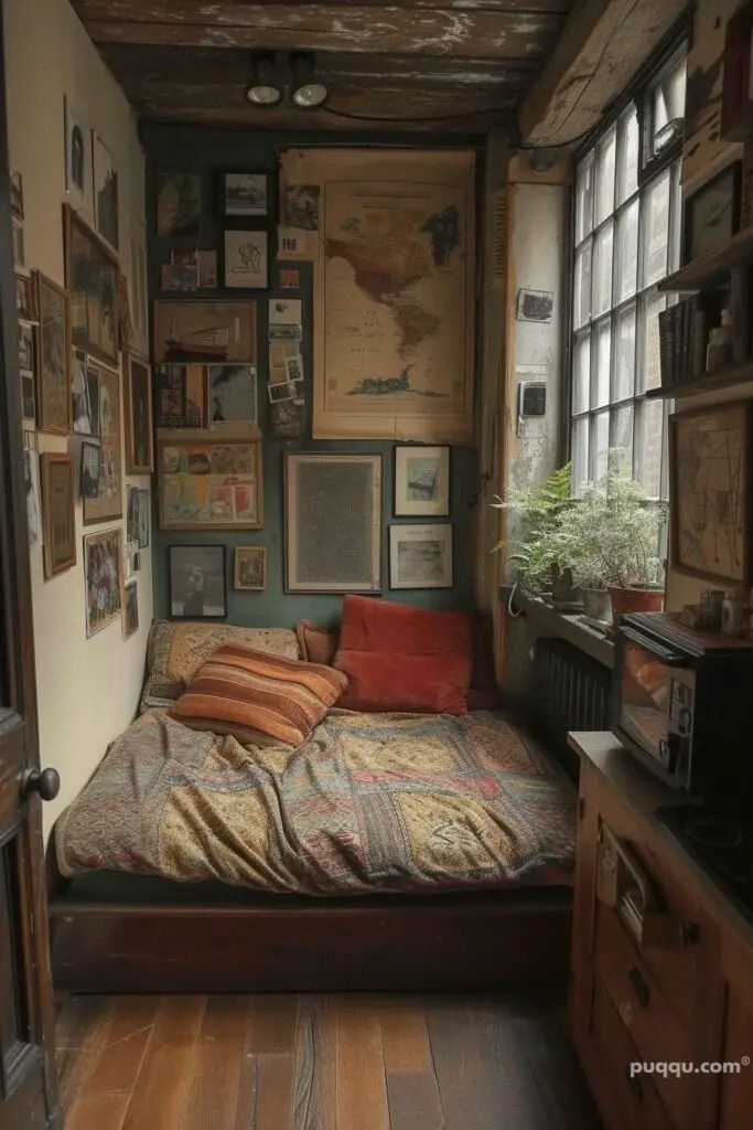 a bed sitting in the middle of a room with lots of pictures on the wall