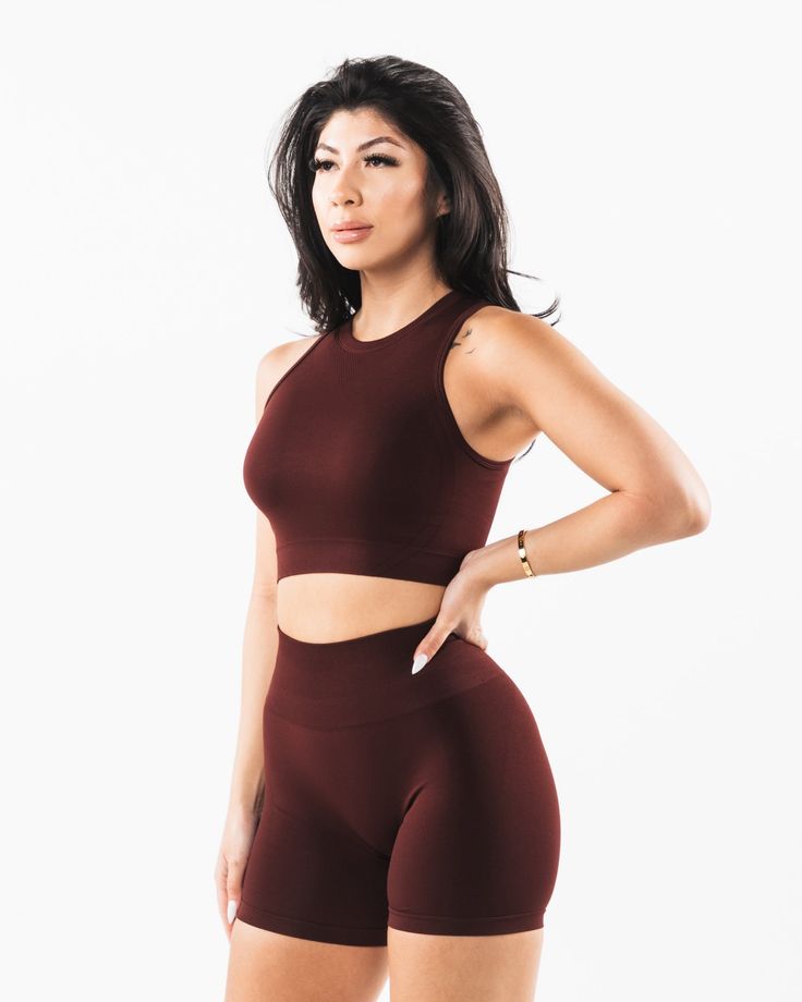 HIGHLIGHTS Crew neckline.. Low impact. Long line length tank. Wide back style. Reinforced binding arm finishing. Alphalete Core logo printed on center lower back FIT SUGGESTION. This item runs true to Alphalete’s standard seamless fit.. If you are between sizes, we recommend sizing up.. Model is 5’3”/160cm, wearing a size S with a 33”/84cm bust. MATERIALS AND WASHING DIRECTIONS. 51% Polyamide, 38% Polyester, 11% Elastane. We recommend washing inside-out on a cold setting. Hang to dry DESCRIPTION Medium Support Seamless Tank Top For Yoga, High Stretch Racerback Tank Top For Training, Supportive Sleeveless Sports Bra For Training, High Stretch Seamless Tank Top For Sportswear, Supportive Fitted Sports Bra With Seamless Construction, Medium Support Sleeveless Sports Bra For Training, High Stretch Seamless Sportswear Tank Top, Sleeveless Medium Support Sports Bra For Training, Sleeveless Sports Bra With Medium Support For Training