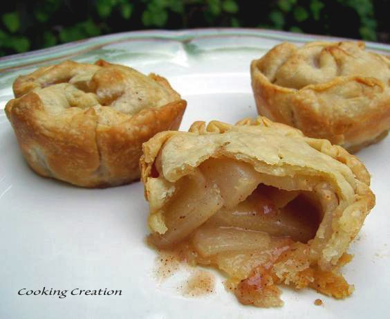 three pieces of apple pie on a white plate