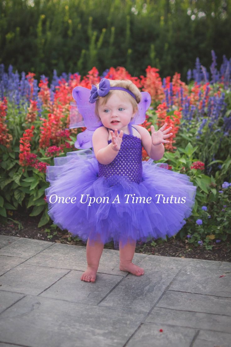 Purple Tutu or Dress This gorgeous purple tutu on an unlined crochet top is so versatile! Wear with a butterfly Halloween costume, use a winter photo prop, first birthday party outfit, or just for play! Wings and headband can be added through the drop down menu. Sizes and Lengths: 0-6 Months 6 Inch Length 6-12 Months 7 Inch Length 12 - 18 Months 8 Inch Length 24 Months 9 Inch Length 3T - 4T 11 Inch Length 5 - 6 12 Inch Length 7 - 8 14 Inch Length 8 - 10 15 Inch Length 10 - 12 16 Inch Length Tutu Toddler Butterfly Costume, Butterfly Costume Kids, First Birthday Party Outfit, Girls Butterfly Costume, Purple Fairy Wings, Butterfly Halloween Costume, Butterfly Halloween, Purple Tutu, Fairy Halloween Costumes