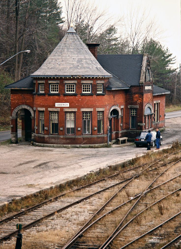 an old train station sits empty on the tracks