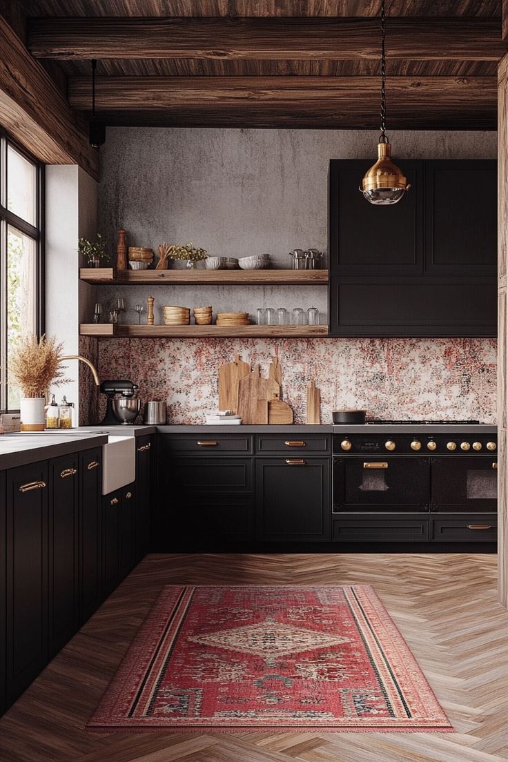 a kitchen with black cabinets and wooden floors, an area rug on the floor is next to the stove