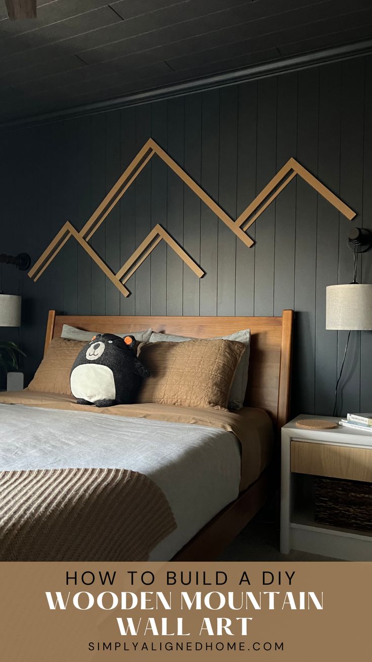 a bedroom with wooden mountain wall art above the bed