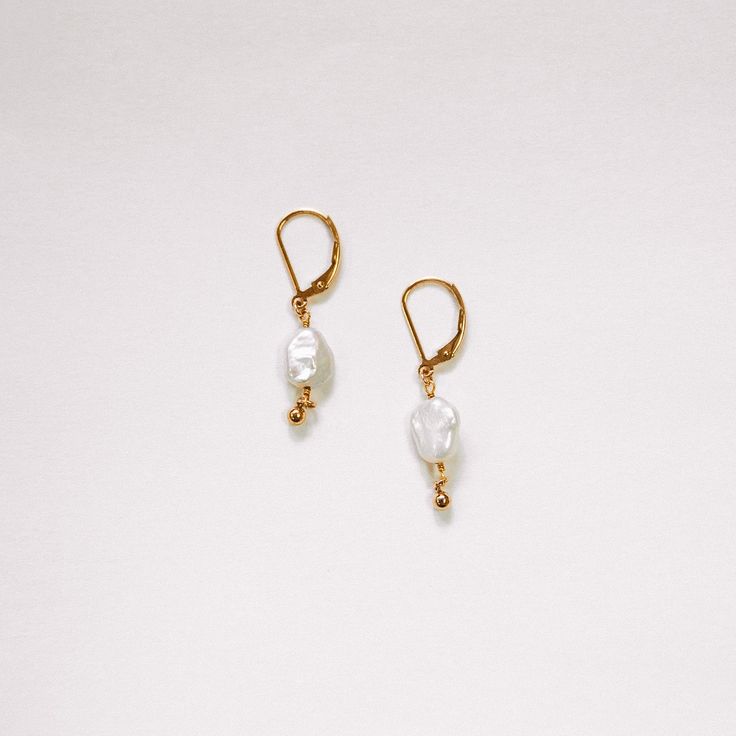 The Pearl Drop Huggie 14k Gold-filled Pearl White Earrings With Pearl Charm, Pearl White Earrings With Pearl Charm In 14k Gold, Handmade 14k Gold Filled Pearl Earrings For Everyday, Small Hoop 14k Gold Filled Pearl Earrings, Classic 14k Gold Filled Earrings With Pearl Charm, Everyday Pearl White 14k Gold Filled Jewelry, Everyday Gold Pearl Hypoallergenic Earrings, Everyday Gold Hypoallergenic Pearl Earrings, Everyday Hypoallergenic Gold Pearl Earrings