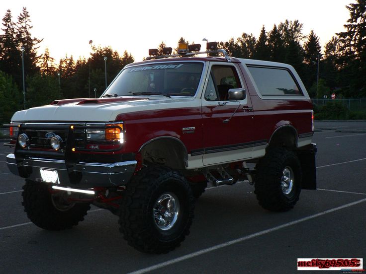 a large red truck parked in a parking lot