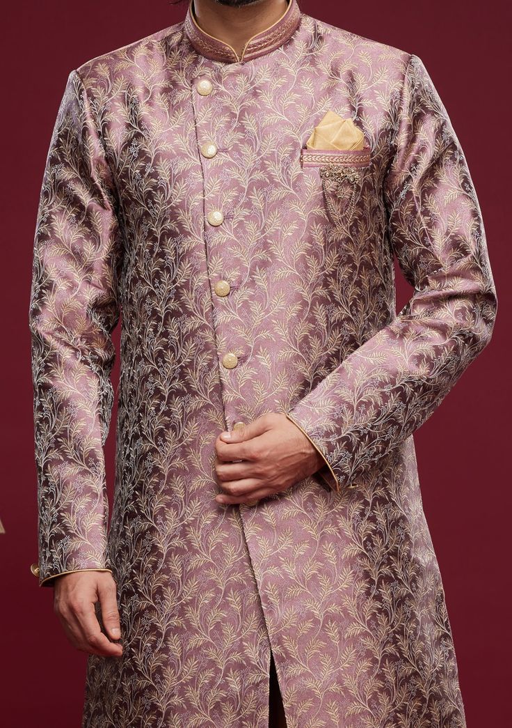 Ready-Made Sherwani With Peshawari Trouser. All Over Jacquard Brocade Style Fabric Top. Art Silk Peshawari Ready Made Trouser. Crafted in Chinese Collar Neck, and Full Sleeve. Satin Lining with Plain Work. High-Quality Matching Buttons. Please Note: The footwear shown in the picture is for presentation and photography purpose only. Color: There might be slight color variation due to lightings and flashes while photo shooting. The color may also vary because of different screen resolutions. Wash Designer Semi-stitched Kurta With Zari Weaving, Designer Pink Sherwani With Pallu, Designer Pink Sherwani With Pallu Detail, Ceremonial Sherwani With Zari Weaving, Diwali Sherwani With Zari Weaving, Designer Fitted Churidar With Zari Weaving, Designer Sherwani With Zari Weaving For Eid, Designer Sherwani With Zari Weaving For Diwali, Designer Churidar With Zari Weaving