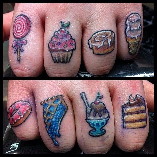 the fingers have different designs on them and are decorated with candies, cakes, lollipops