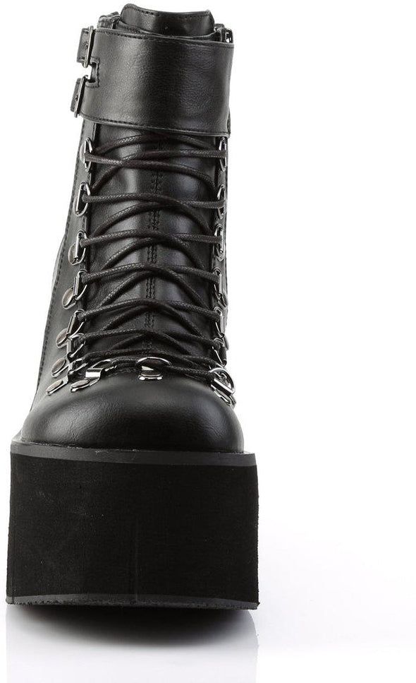 4 1/2" Platform Faux Lace-Up Ankle Boot, Side Zipper - Fit Guide: True To Size - Heel Specifications: 4 1/2" Platform - Country of Origin: Imported - Brand: Demonia Punk Style Platform Boots In Synthetic Material, Punk High Ankle Platform Boots In Synthetic, High-top Platform Boots With Zipper In Faux Leather, Edgy High-top Polyurethane Boots, High-top Faux Leather Platform Boots With Zipper, Black Gothic Synthetic Boots, Black Synthetic Alternative Platform Boots, Black High Ankle Platform Boots In Faux Leather, Black Pointed Toe Platform Boots In Faux Leather