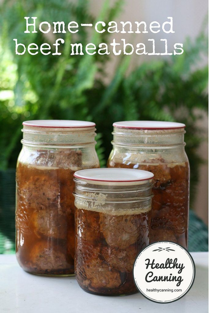 three jars filled with food sitting on top of a table