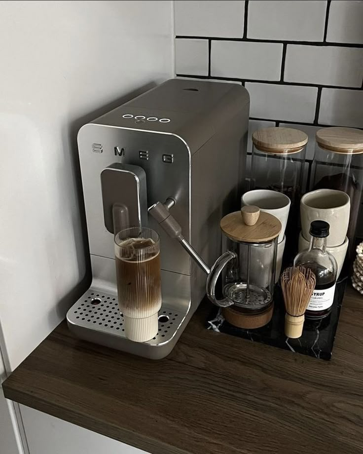 an espresso machine sitting on top of a kitchen counter