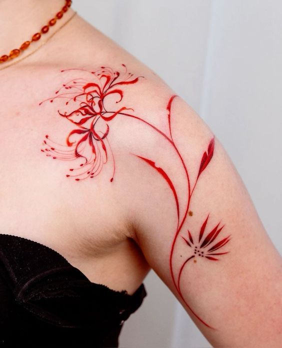 a woman with a tattoo on her shoulder