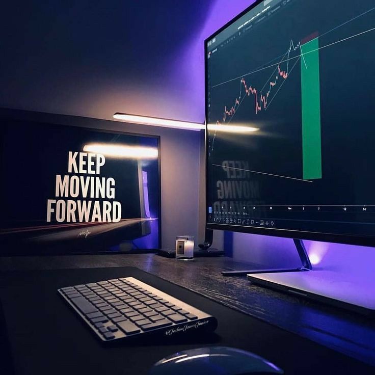 a computer monitor sitting on top of a desk with a keyboard and mouse next to it