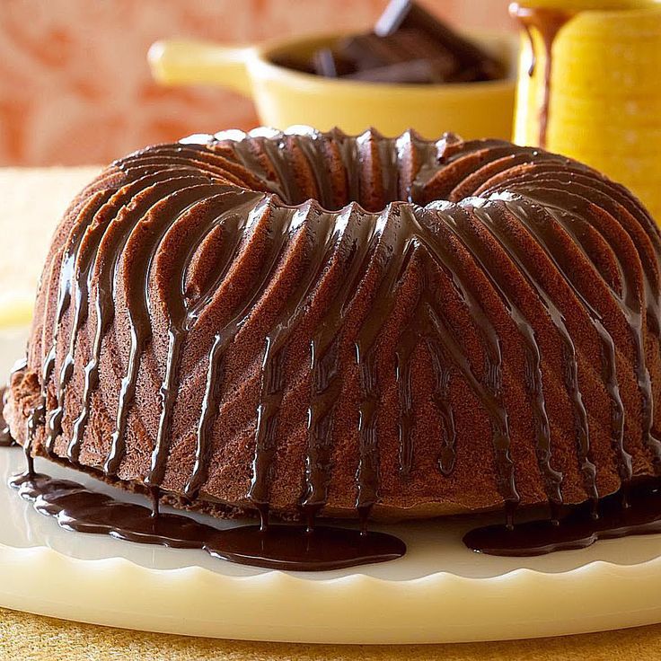 a bundt cake with chocolate icing on a plate