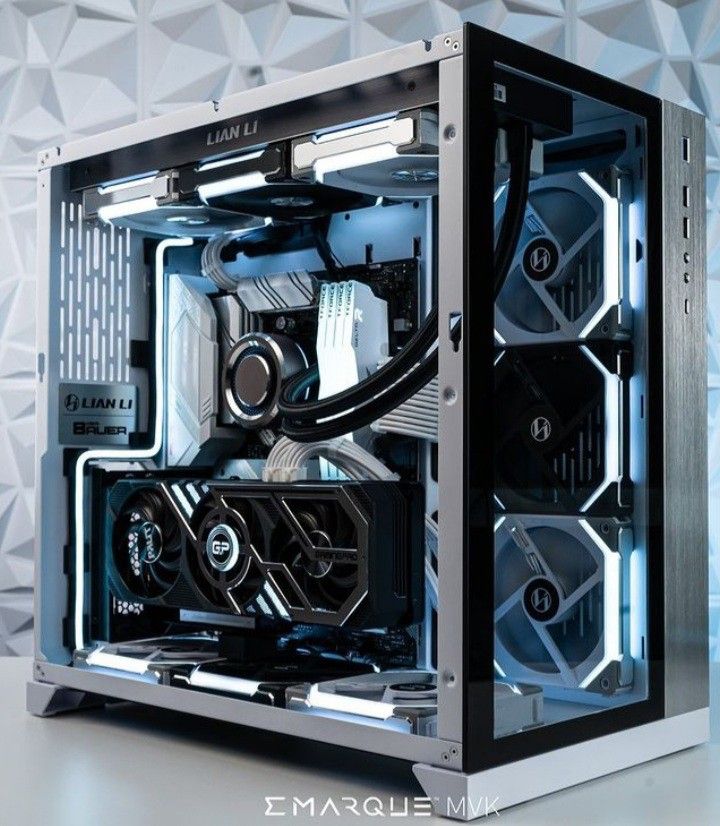 a computer case sitting on top of a white table next to a black and silver wall