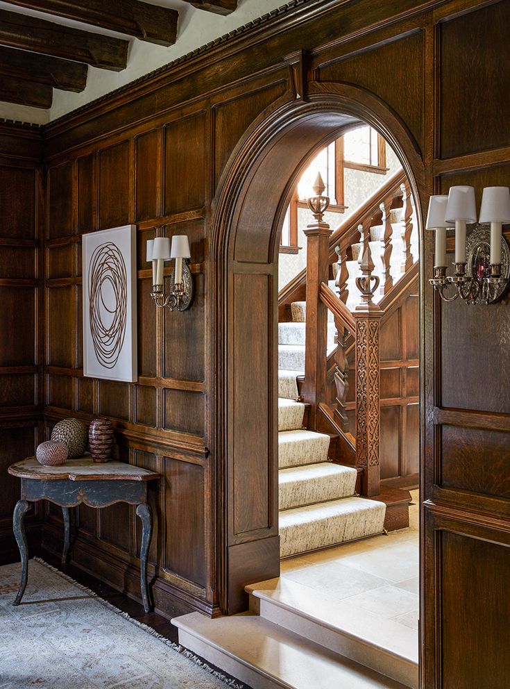 an entry way with stairs and chandelier