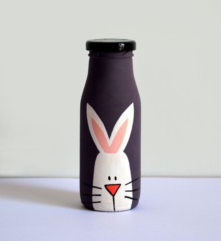 a bottle with a bunny face painted on it