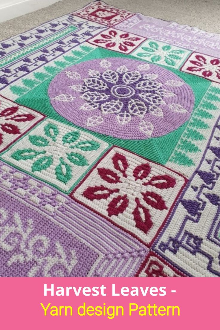 a crocheted rug with the words harvest leaves written in purple, green and red