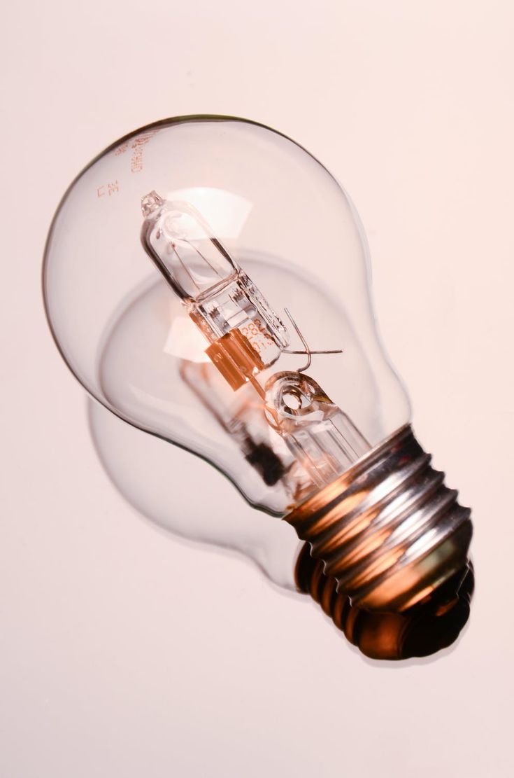 an old fashioned light bulb on a white background with no lighting bulbs in the middle