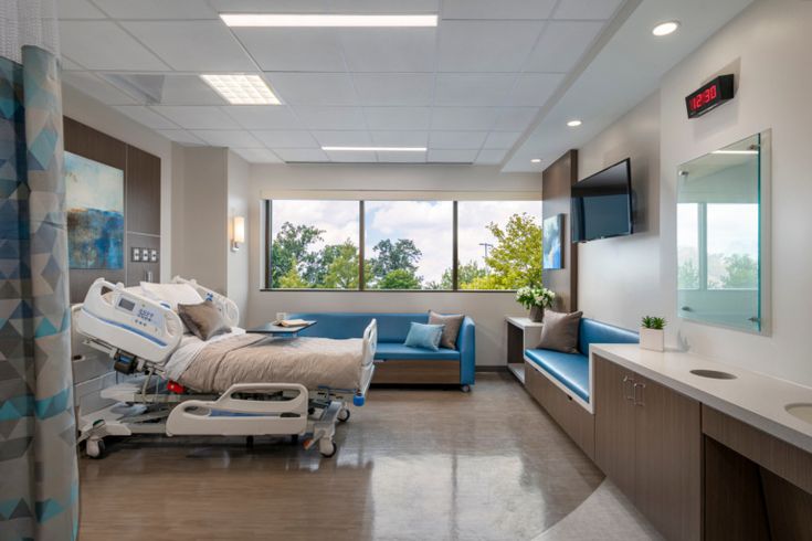 an empty hospital room with medical equipment in it