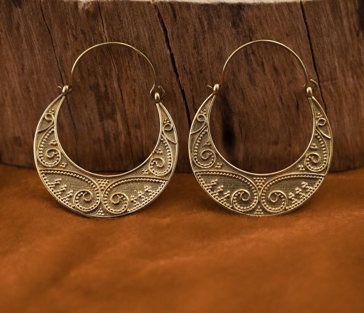 ↠Handcrafted in India. ↠These earrings are handcrafted with brass ↠The color of brass is very close to gold, which makes it quite attractive. ↠Wire thickness is 0.1 cm These earrings are made for standard holes PLEASE NOTE that You don't need a PayPal Account to pay for your items via PayPal. You can pay by simply: ↠ Choose PayPal at checkout. ↠ After you submit your order click the PAY NOW button. ↠ Scroll Down and you will see the option to pay with a Credit/Debit Card WITHOUT having to log in Bohemian Crescent Hoop Earrings With Ear Wire, Festive Handmade Brass Hoop Earrings, Bohemian Crescent Hoop Earrings Nickel Free, Traditional Adjustable Small Hoop Jewelry, Traditional Small Hoop Nickel-free Jewelry, Nickel-free Traditional Small Hoop Earrings, Small Hoop Jewelry For Festivals As Gifts, Small Hoop Jewelry For Festivals And Gifts, Traditional Bronze Earrings With Ear Wire