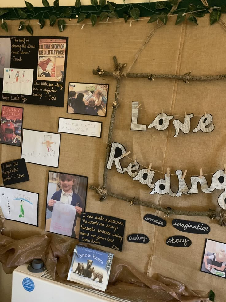 a bulletin board with pictures and magnets on it that says love reading written in cursive writing