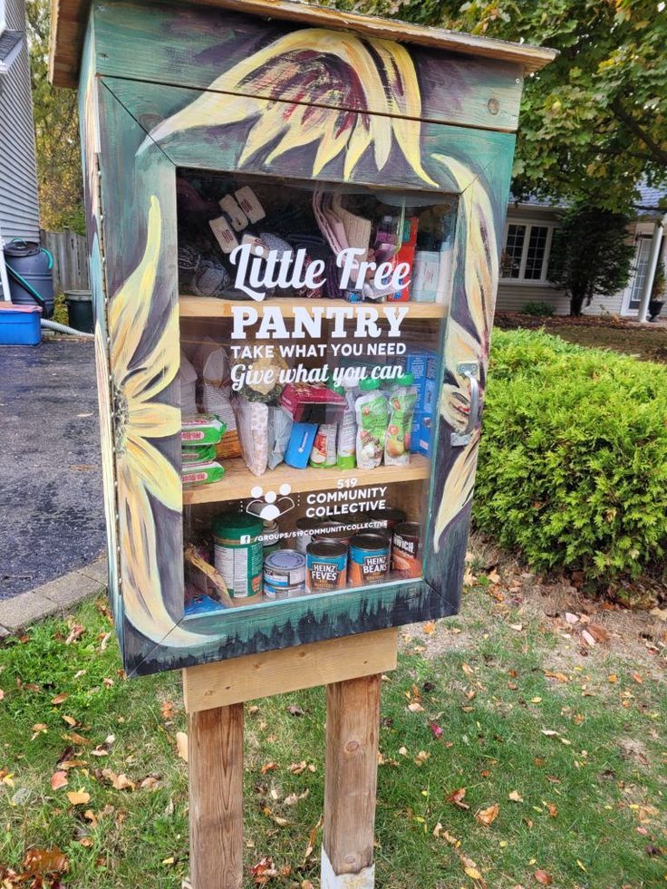 a little free pantry sign in the grass