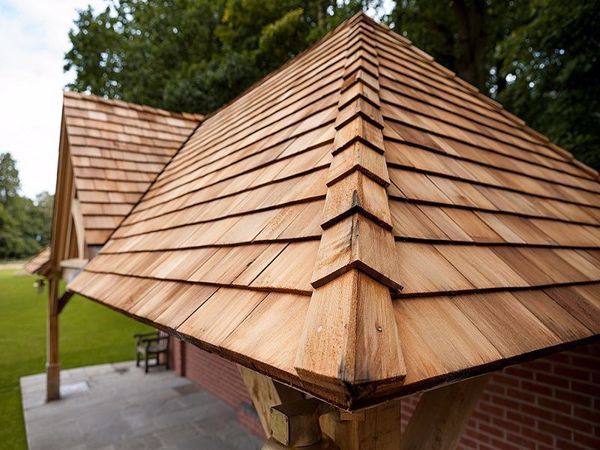 the roof of a house with wooden shingles