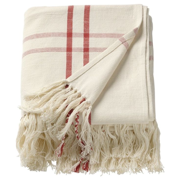 a white and red plaid blanket with fringes