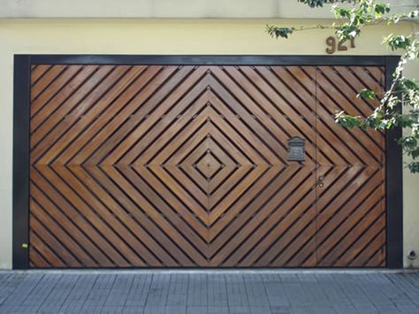 a large wooden garage door on the side of a building