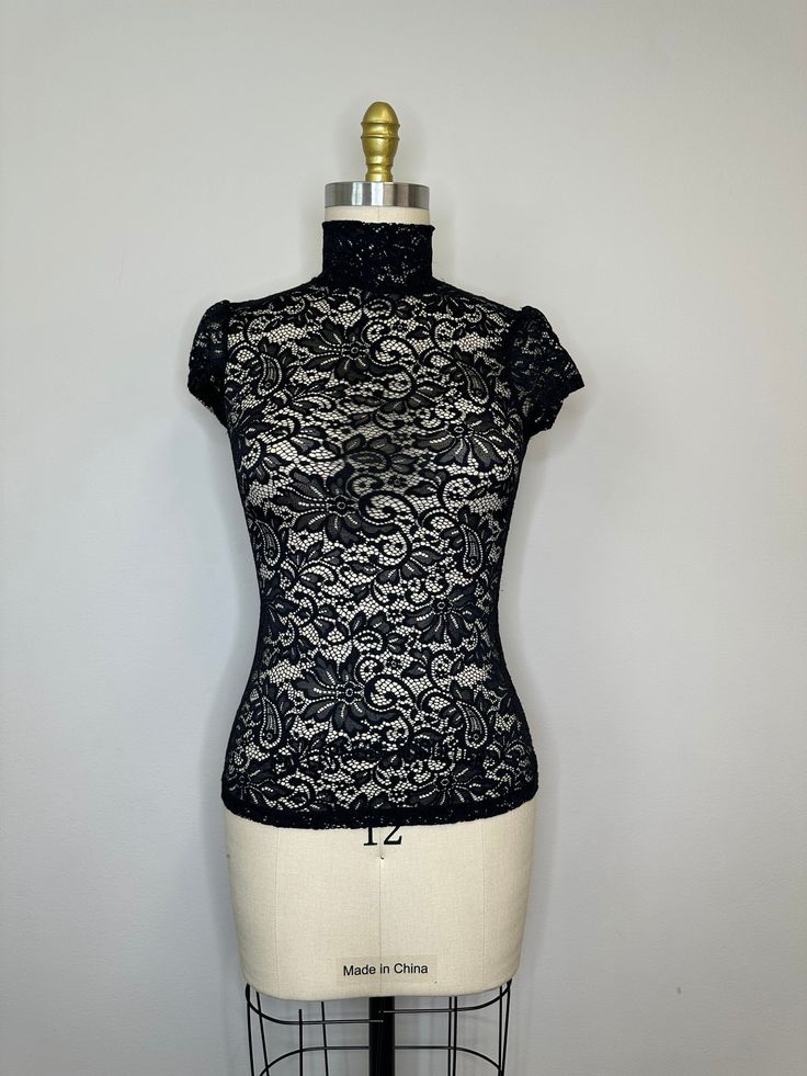 Measurements  Brand: Express  Size: XS  Pit to Pit: 15 Length: 23 inches  Material: 100% polyester Elegant Fitted Sheer Top, Chic Sheer Fitted Tops, Fitted Chic Lace Top, Fitted Lace Top In Chic Style, Fitted Sheer Lace Top With Short Sleeves, Fitted Lace Top With Short Sleeves, Sheer Fitted Blouse, Elegant Non-stretch Sheer Top, Chic Stretch Lace Top With Short Sleeves