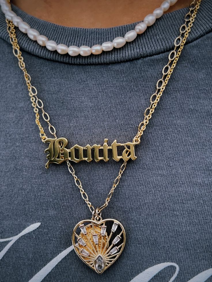 Live in purpose with the BONITA NECKLACE! 18K gold plated stainless steel. Engraved Gold Plated Chain Necklace, Gold Plated Name Necklace Pendant, Gold Plated Engraved Chain Necklace, Engraved Gold-plated Chain Necklace, Personalized Vintage Gold Plated Necklace, Vintage Personalized Gold Plated Necklace, Gold Plated Name Necklace With Clavicle Chain, Gold-plated Engraved Chain Necklace, Vintage Gold Necklace With Figaro Chain