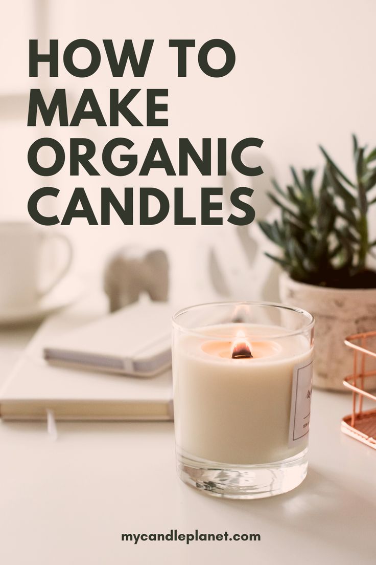 a candle sitting on top of a white table next to a notebook and pen with the words how to make organic candles