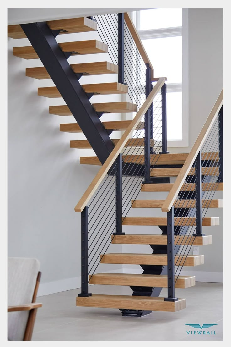 a wooden and metal staircase in a house