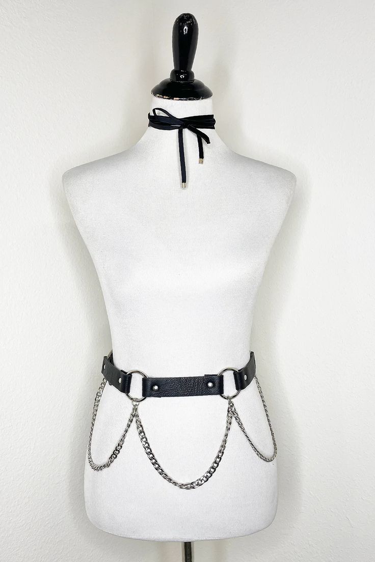 Add a little edge to any outfit with this chain belt. This black belt features metal silvertone rings and a chain. Imported. Waist is 28" - 32" Black Chain Belt For Festival, Punk Black Chain Belt With Belt Loops, Black Punk Chain Belt With Belt Loops, Black Chain Belt With Belt Loops For Festivals, Black Chain Belt For Night Out, Edgy Black Metal Chain Belt, Edgy Waist Chain For Festivals, Adjustable Edgy Chain Belt, Black Metal Chain Belt For Night Out