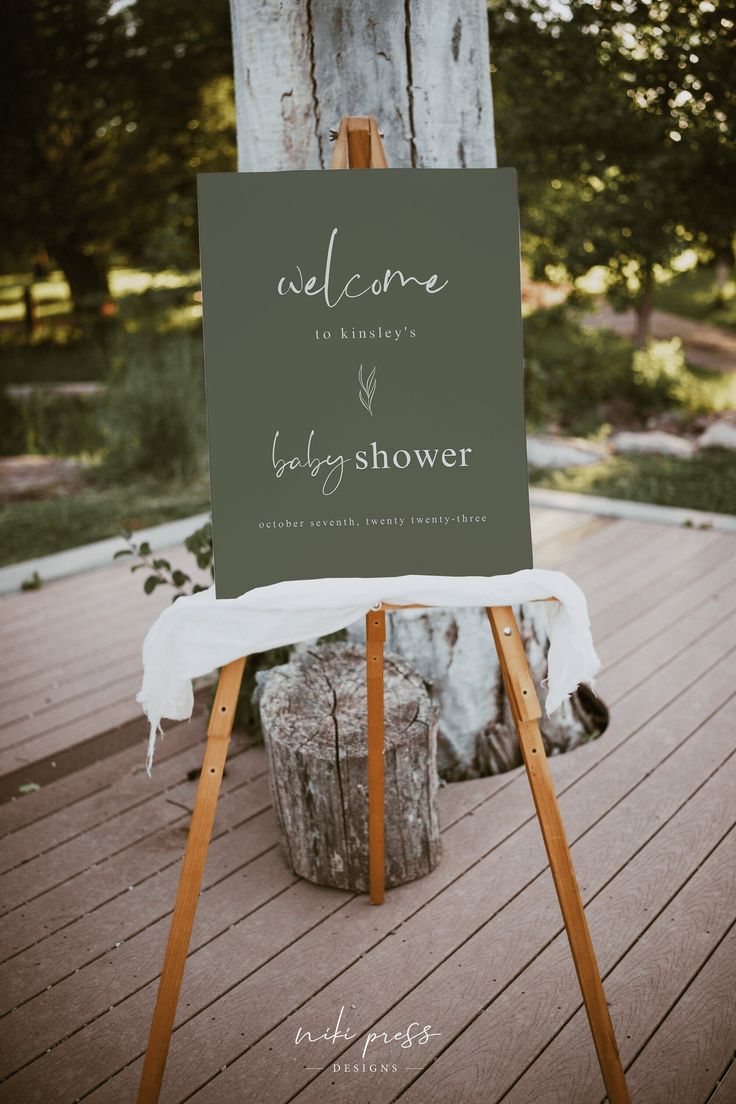 an easel with a welcome sign on it