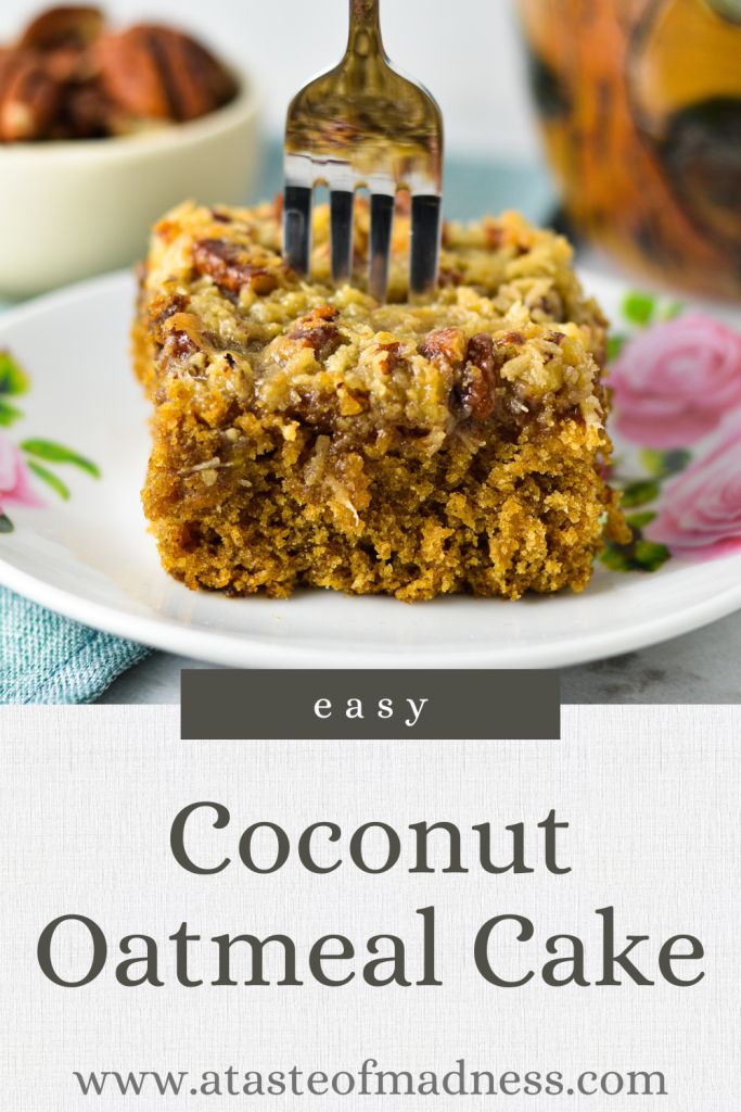 a piece of coconut oatmeal cake on a plate with a fork stuck in it