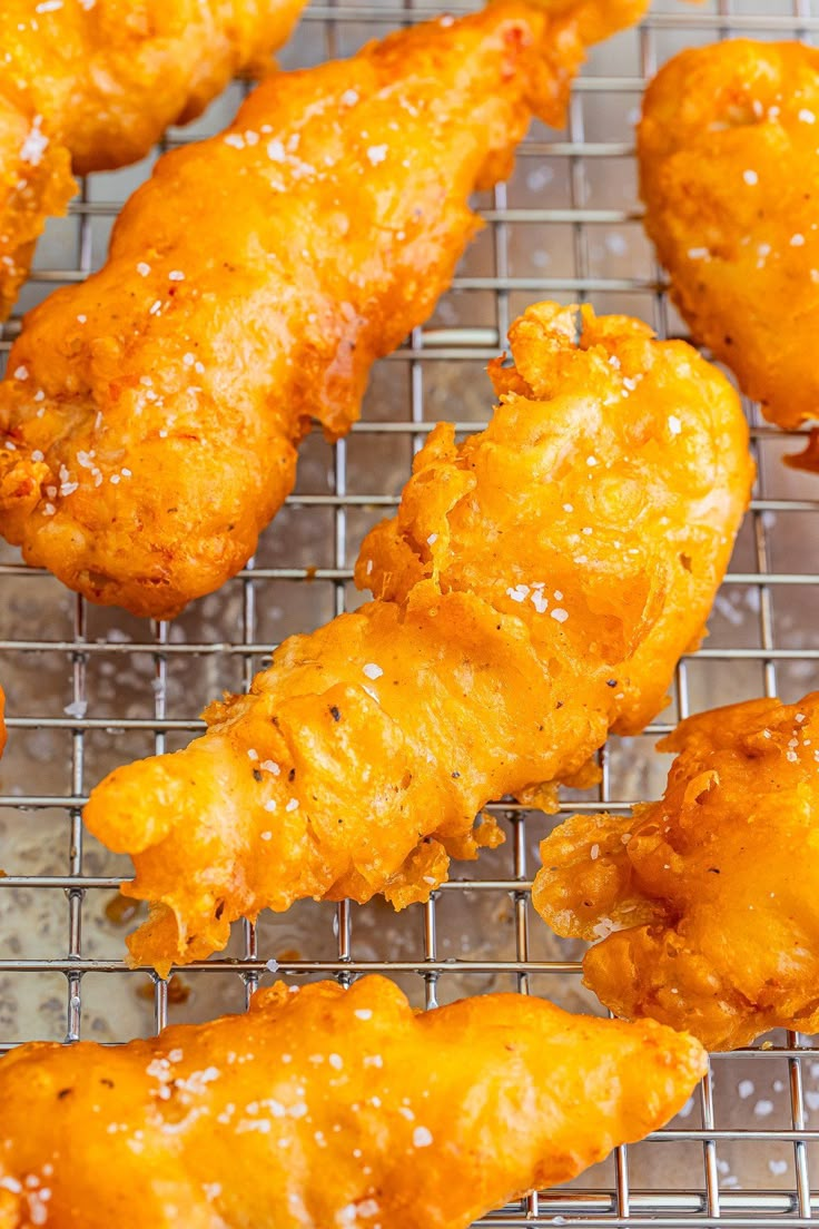 fried chicken wings on a cooling rack ready to be cooked in the oven for dinner